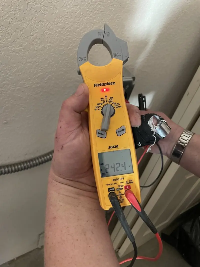 Voltage testing with clamp meter during Generator Installation in San Marino